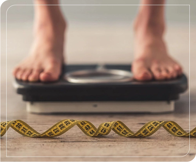 A person standing on a scale with tape around it.